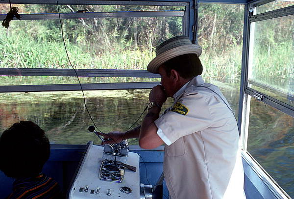 Tour boat guide George Bower talking into the microphone while giving a tour - Wakulla Springs, Florida