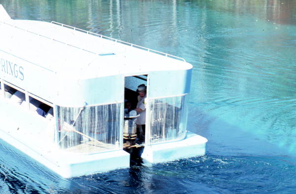 Tour boat moving along - Wakulla Springs, Florida.