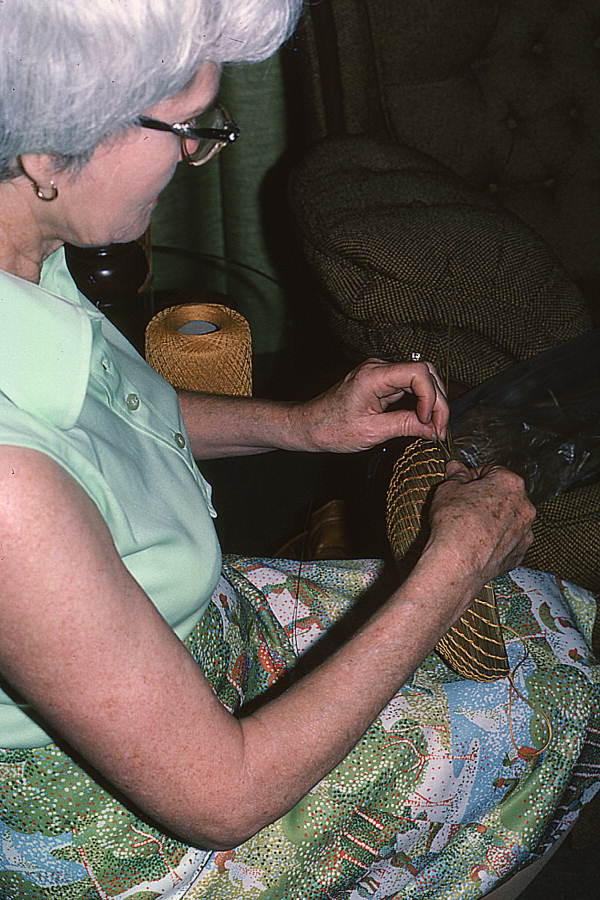 Creek Indian woman making a pine needle coil basket