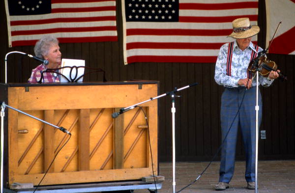 Piano player Lucy Lovelace and fiddler Troy Lovelace performing - White Springs, Florida
