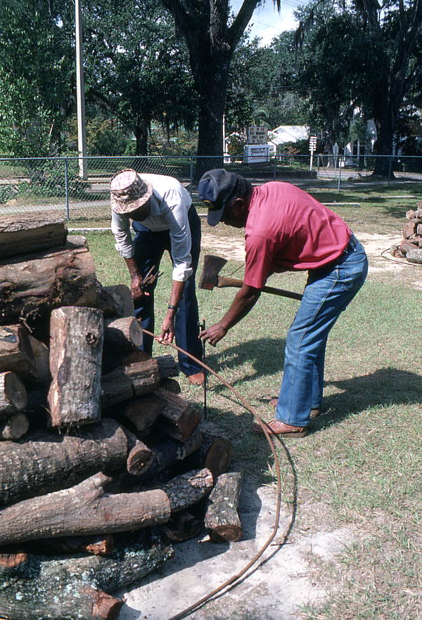 Men getting the firewood ready for a mullet roast - Monticello, Florida