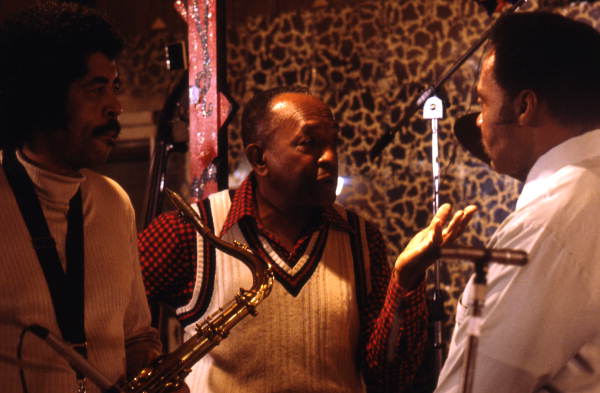 John Boller and Harold Andrews discussing music with an unidentified man - Pensacola, Florida.