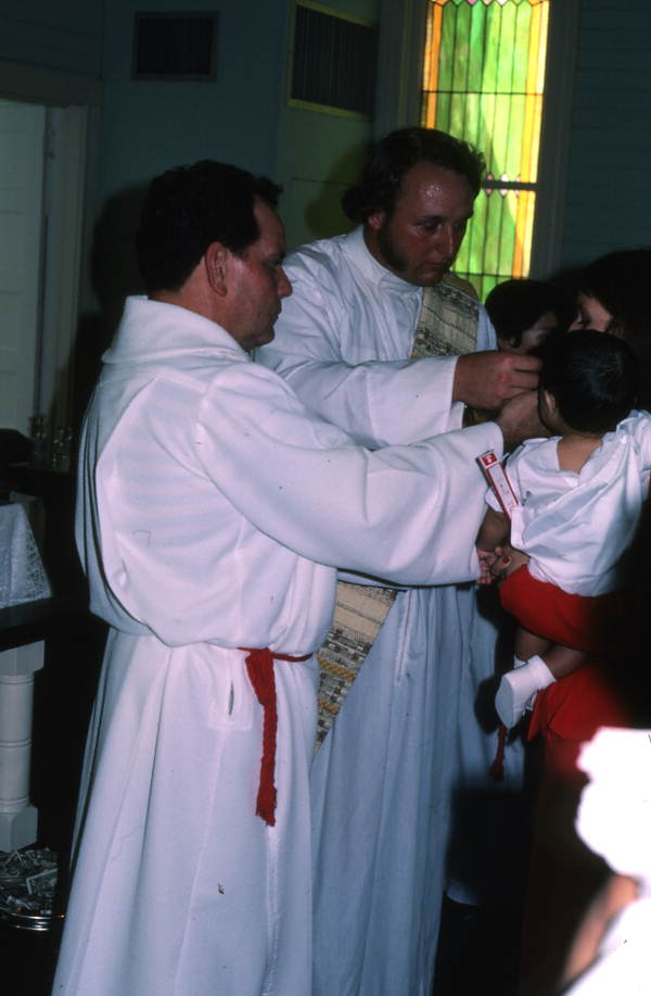 Chuck Bard and Miguel Alvarez performing a baptismal ceremony - Seville, Florida