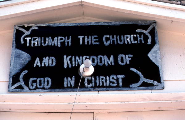 Sign above the door of the Triumph The Church and Kingdom of God in Christ - Crescent City, Florida.