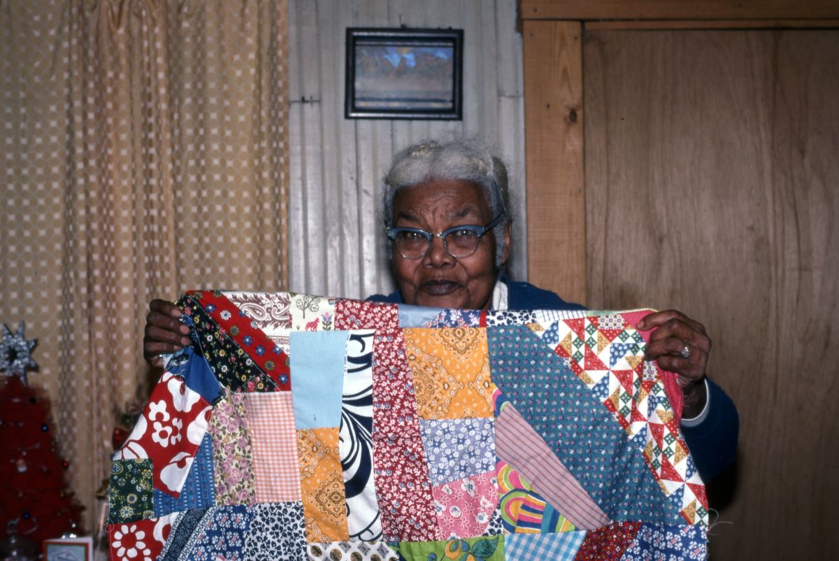 Ruth Rowe with a "crazy square" quilt she made - Pomona Park, Florida.