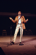 Gamble Rogers telling a story at the 1985 Florida Folk Festival - White Springs, Florida