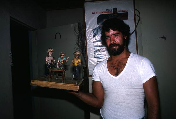 Jose Orta with a woodcarving he made- Miami, Florida.