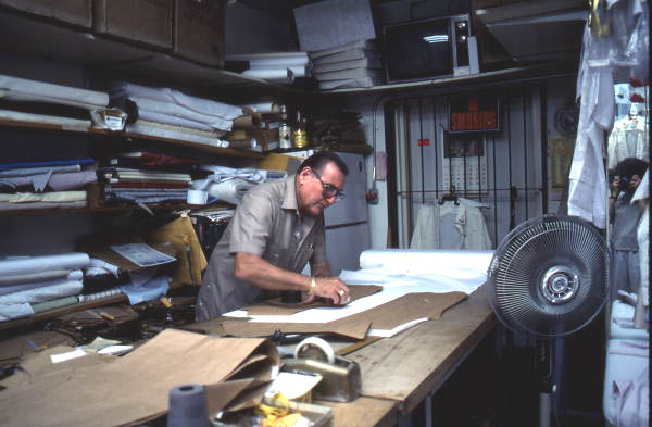 Ramon Puig measuring a pattern to make clothing - Miami, Florida.