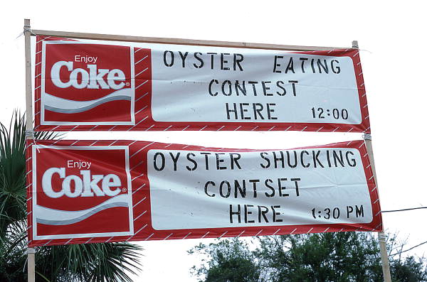 Signs for oyster shucking and eating contests..