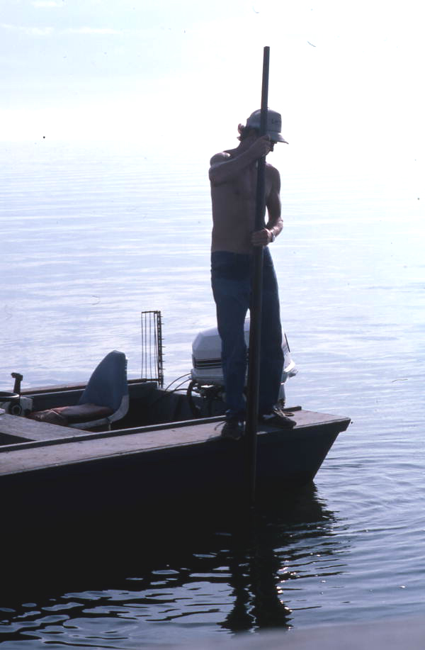 Cletis Anderson using oyster tongs - Apalachicola Bay, Florida.