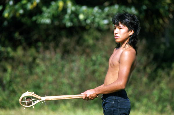 Seminole boy playing stick ball - Big Cypress Reservation, Florida