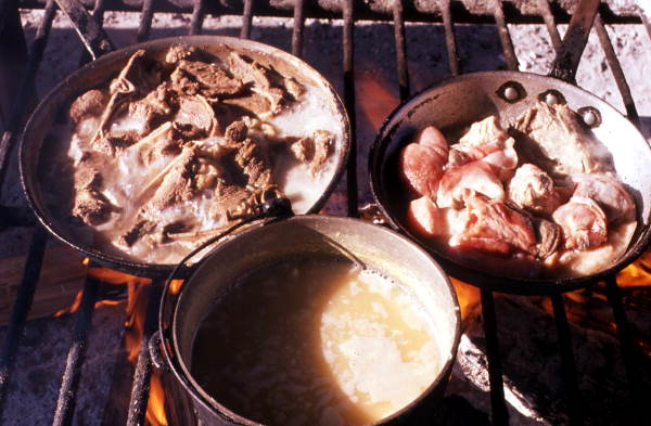 Dinner cooking on open fire at Rosie and Alice Billie's family camp - Ochopee, Florida