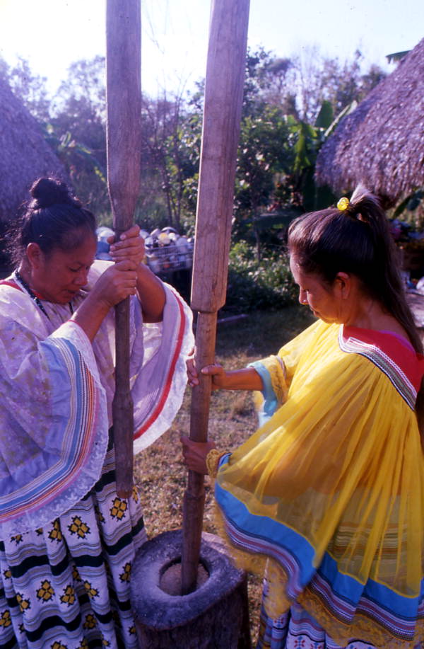 Sisters Alice and Rosie Billie pound corn - Ochopee, Florida