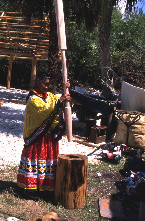 Susie Jim Billie pounds corn - Ochopee, Florida