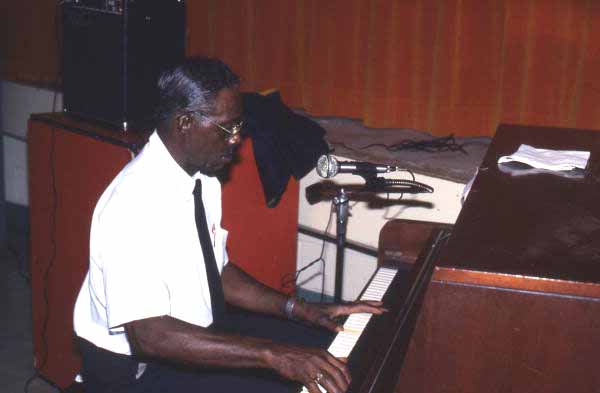 Alex McBride playing blues piano at Pine Estates Elementary School - Jacksonville, Florida.