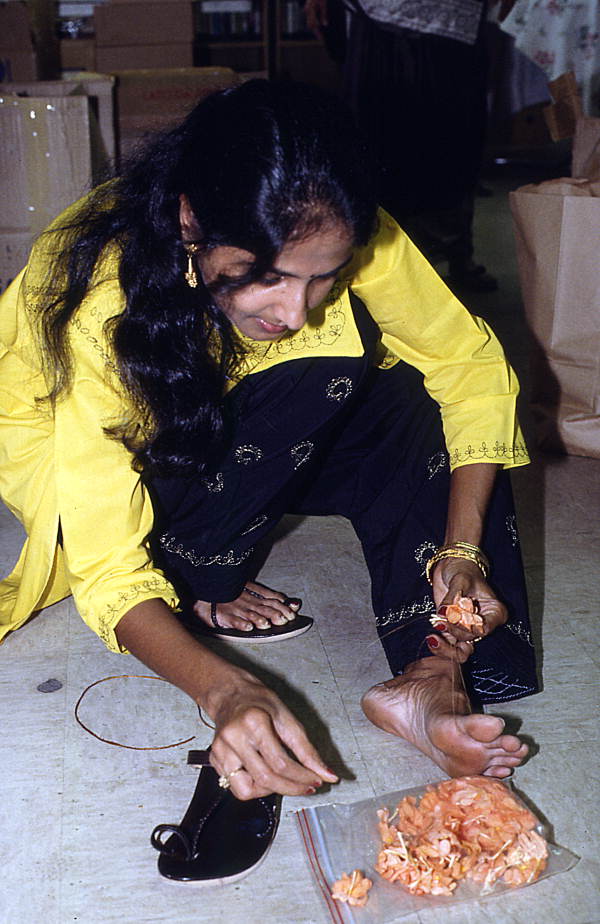 Poornima Shantharam braiding flowers - Jacksonville, Florida.