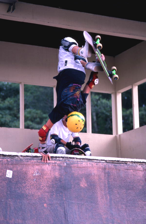 Skateboarder on a half pipe performing aerial moves - Jacksonville, Florida