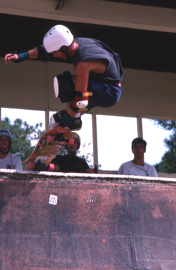 Skateboarder on a half pipe performing aerial moves - Jacksonville, Florida