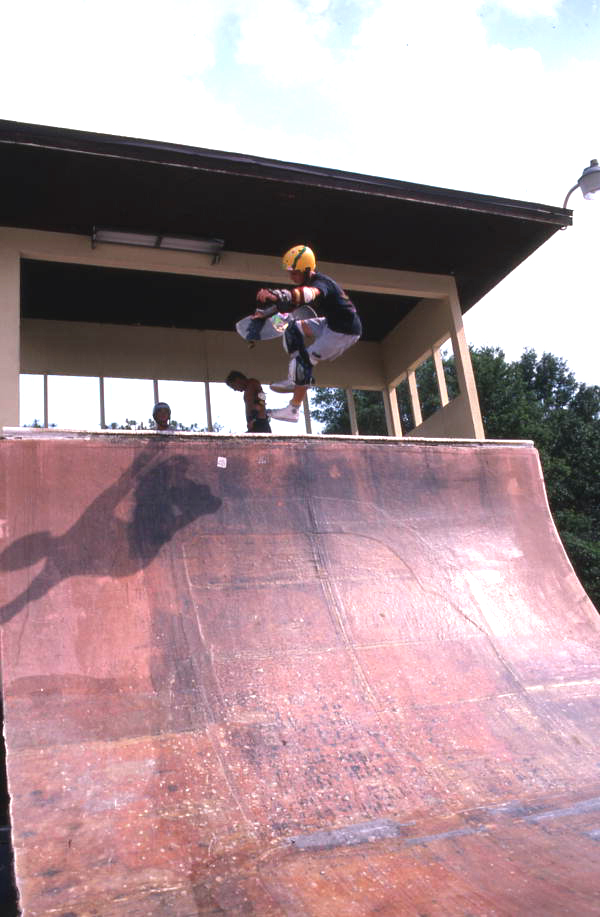 Skateboarder on a half pipe performing aerial moves - Jacksonville, Florida.