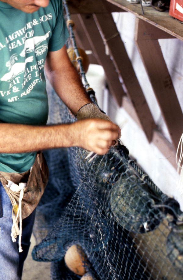 Rickey Doublerly knitting a fishing net - Jacksonville, Florida.