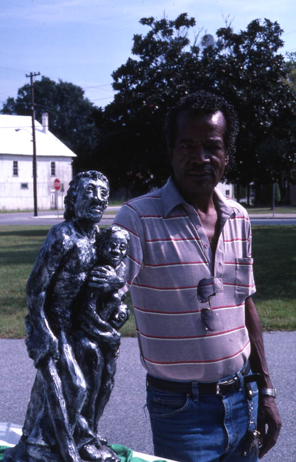 Pharaoh Baker with one of his sculptures - Lake City, Florida