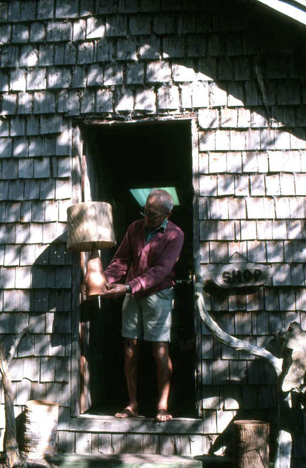 Tom Gaskins holding a cypress lamp at his Cypress Knee Museum - Palmdale, Florida