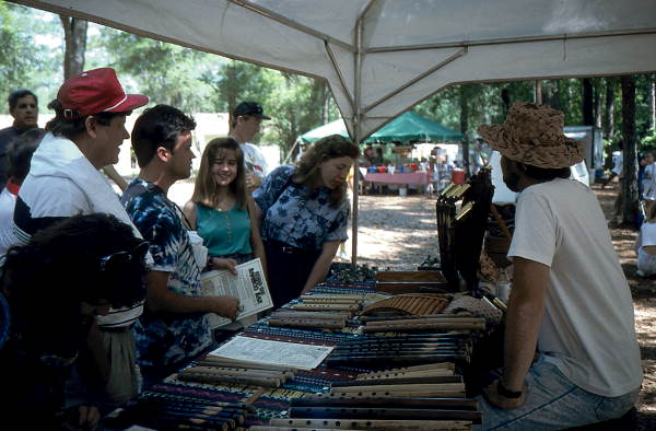 James Brock displaying his bamboo flutes at the 1992 Florida Folk Festival - White Springs, Florida