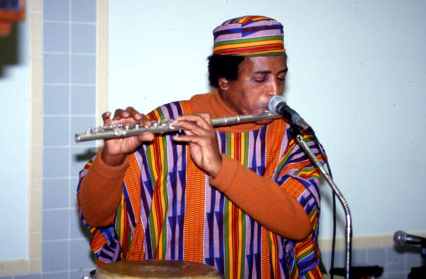 Member of Voice of the Ancestors playing a flute - Jacksonville, Florida