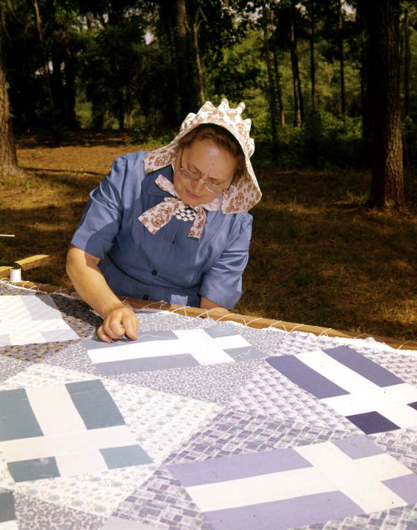 Woman at a quilting bee.