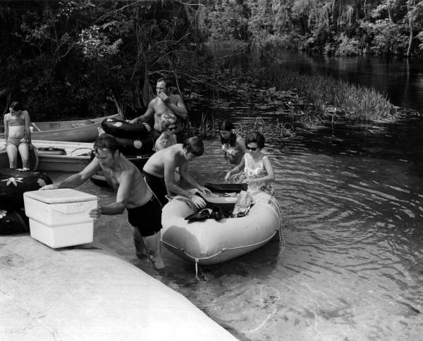 Visitors unload their supplies from the float at the spring - Columbia County, Florida