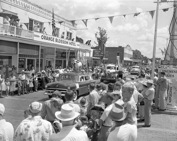 Fourth of July parade with members from the Heart Bar Ranch in front of the Orange Blossom Hotel - Kissimmee, Florida.