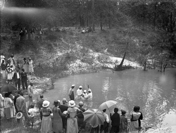 African American citizens attend a baptism
