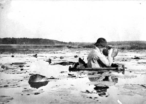 Max Campbell bailing out a hunting blind at Lake Jackson