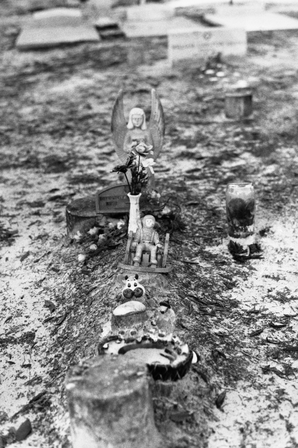 Grave decorated with various mementos at Macedoni Cemetery - Baker County, Florida