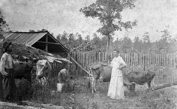 Mr. and Mrs. Hasty on the Hasty family farm - Calhoun County
