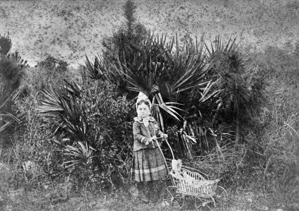 Port Orange girl with doll in carriage