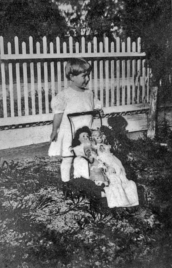 Louise Bomlay with carriage and dolls