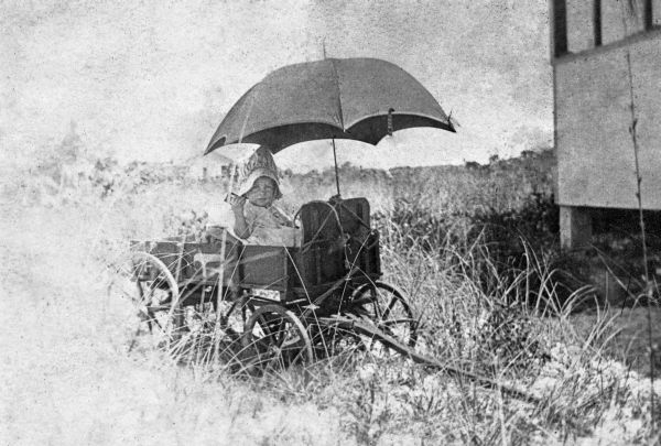 Dorothy Koester in toy wagon - Estero Island, Florida