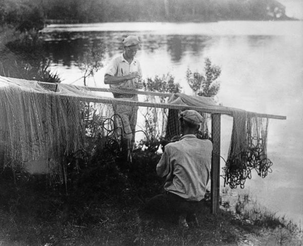 Men repairing nets on Mack Bayou near DeFuniak Springs, Florida
