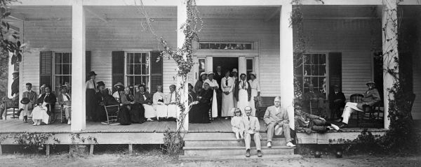 Guests on the porch of the main cottage.