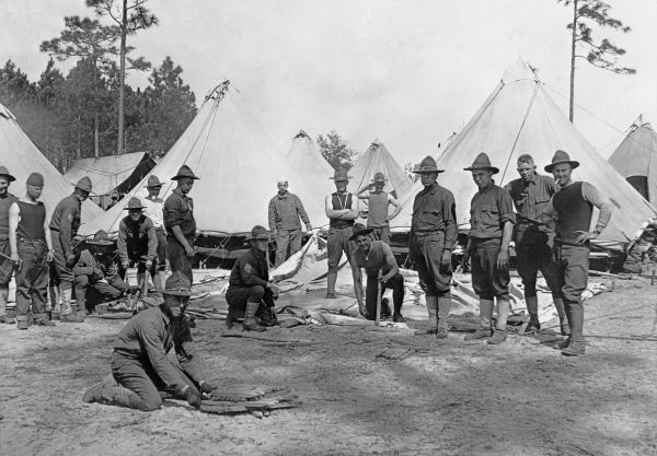 Soldiers setting up tents - Camp Joseph E. Johnston