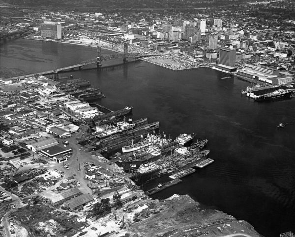 Aerial view of riverfront with Gibbs Corporation in foreground.