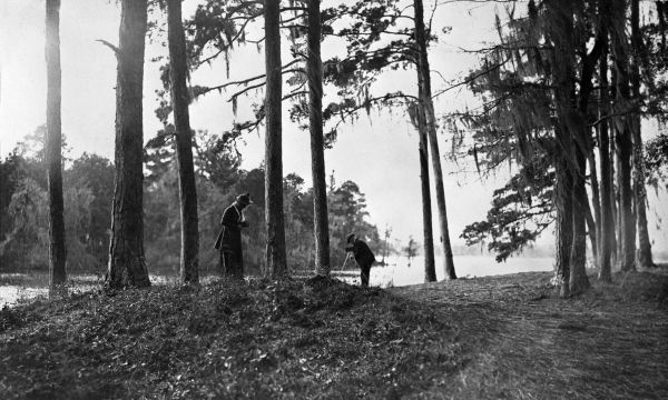 Genevieve and Edward Beadel at lakeside with cameras - Lake Iamonia, Florida