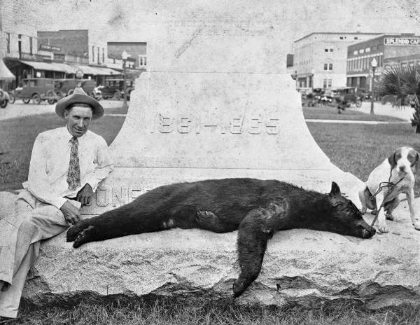 Finley McMillan with bear that he killed