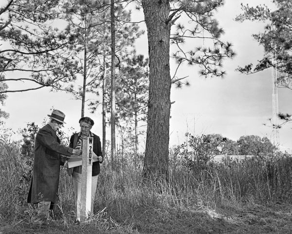 Henry L. Beadel and Malvina checking fire plots - Tallahassee, Florida.