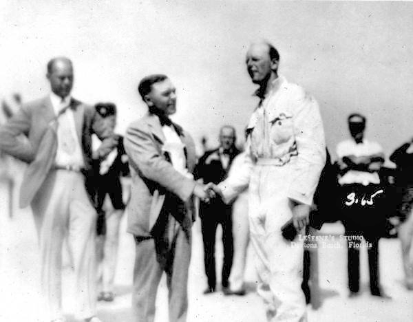Sir Henry Segrave shaking hands with Sig Haugdahl - Daytona Beach, Florida.