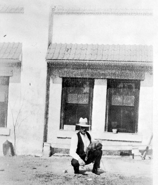 Paul Burnette standing in front of the Suwanee River park store with Kayo the Monkey
