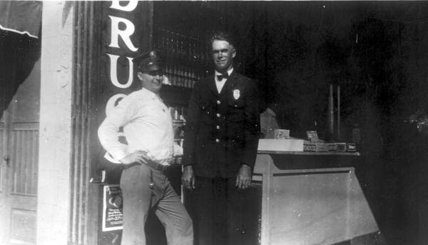 Arthur William Morrison and friend outside his drugstore - Miami, Florida