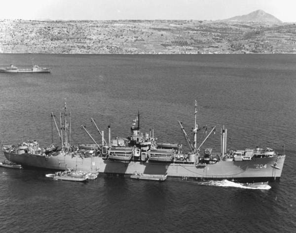 Attack transport U.S.S. Sarasota (APA-204) with landing craft alongside