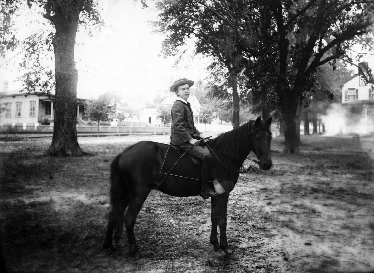Boy on a pony.